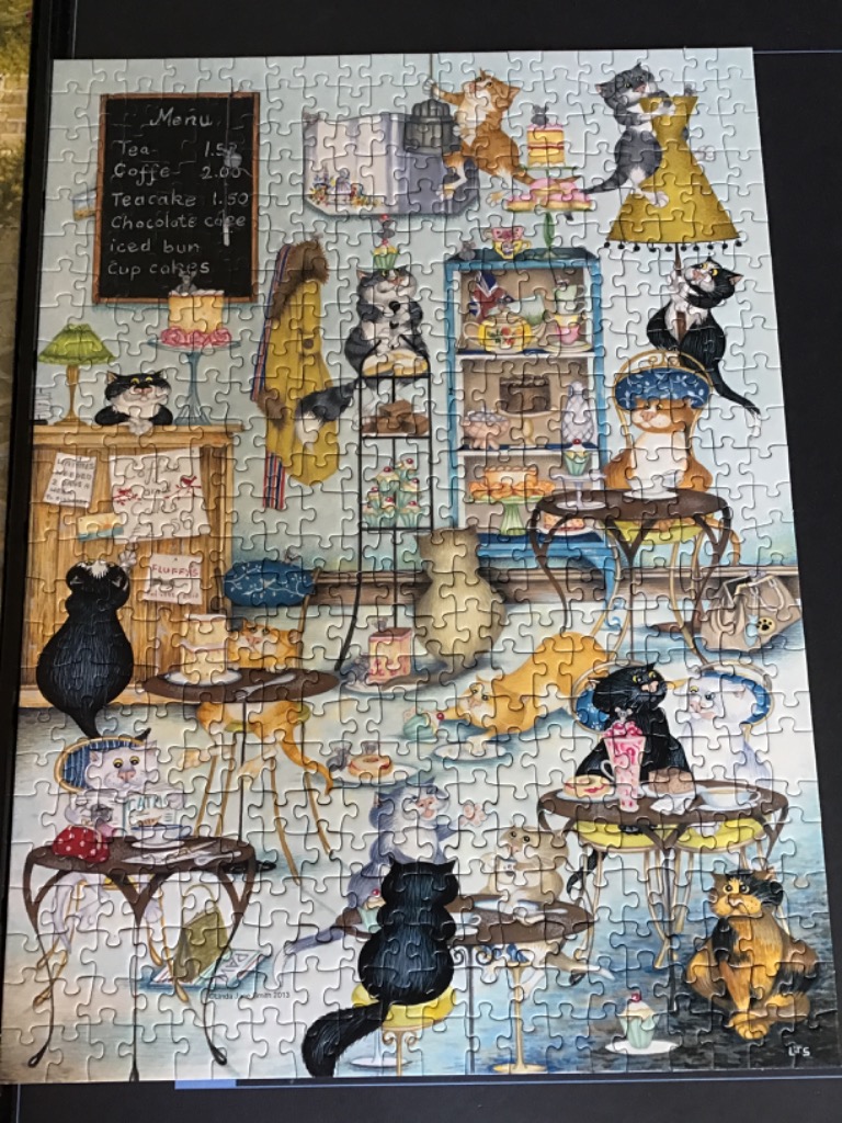 A whimsical illustration of a cozy cafe filled with numerous cats enjoying tea, cake, and pastries.