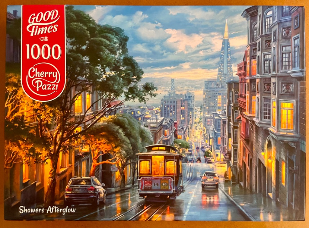 San Francisco street scene with a cable car, Victorian architecture, and the Transamerica Pyramid at sunset.