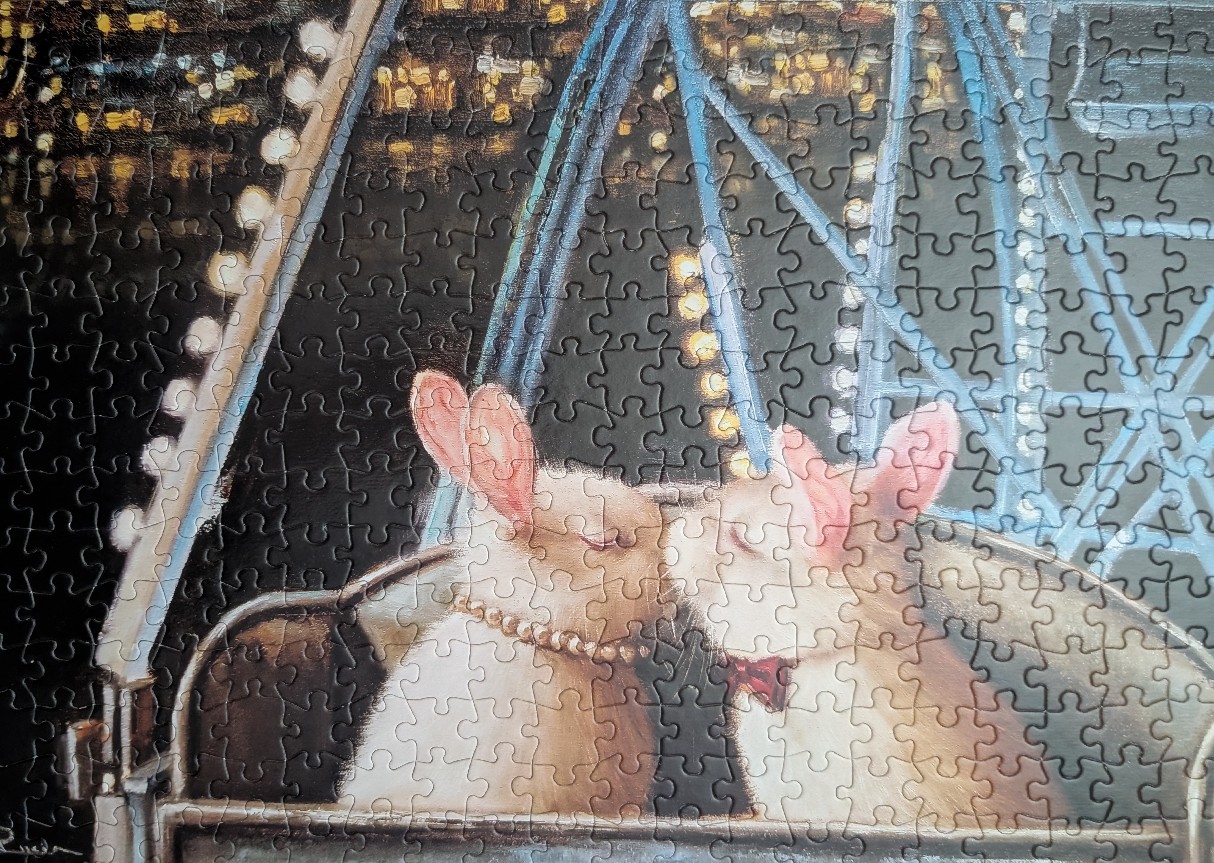 Two white rabbits wearing accessories kissing in a ferris wheel car at night.
