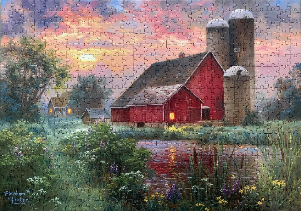 A peaceful rural farm scene at sunset with a red barn, three silos, and a reflective pond surrounded by wildflowers.
