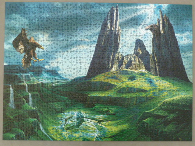 A fantasy illustration of a giant eagle-shaped rock formation in a lush green valley with a flying eagle.