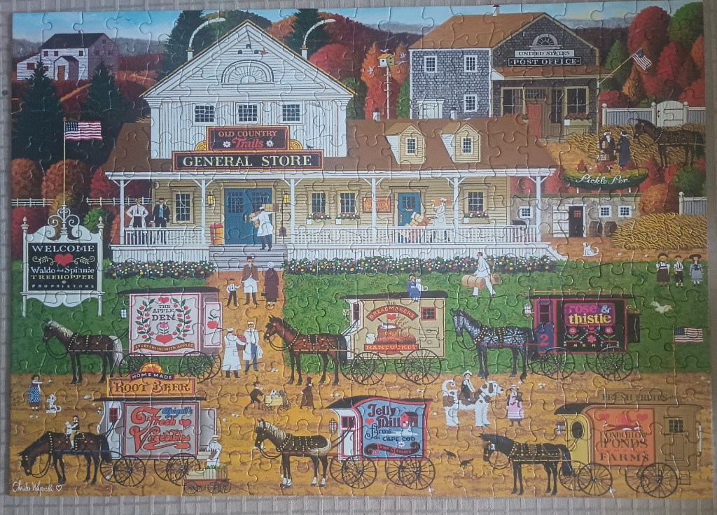 Folk art scene of an old-fashioned general store with horse-drawn market wagons on a village lawn.