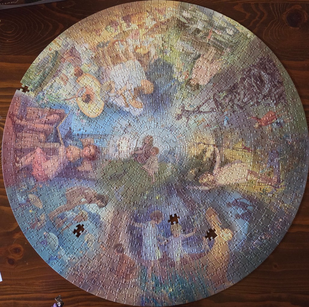 Circular impressionist painting of figures in a garden setting