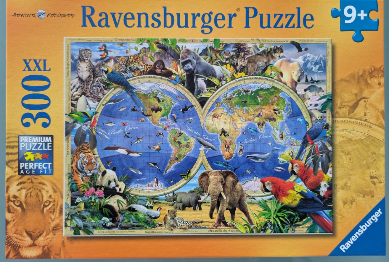 A montage of various global animals superimposed over a two-hemisphere map of the world.