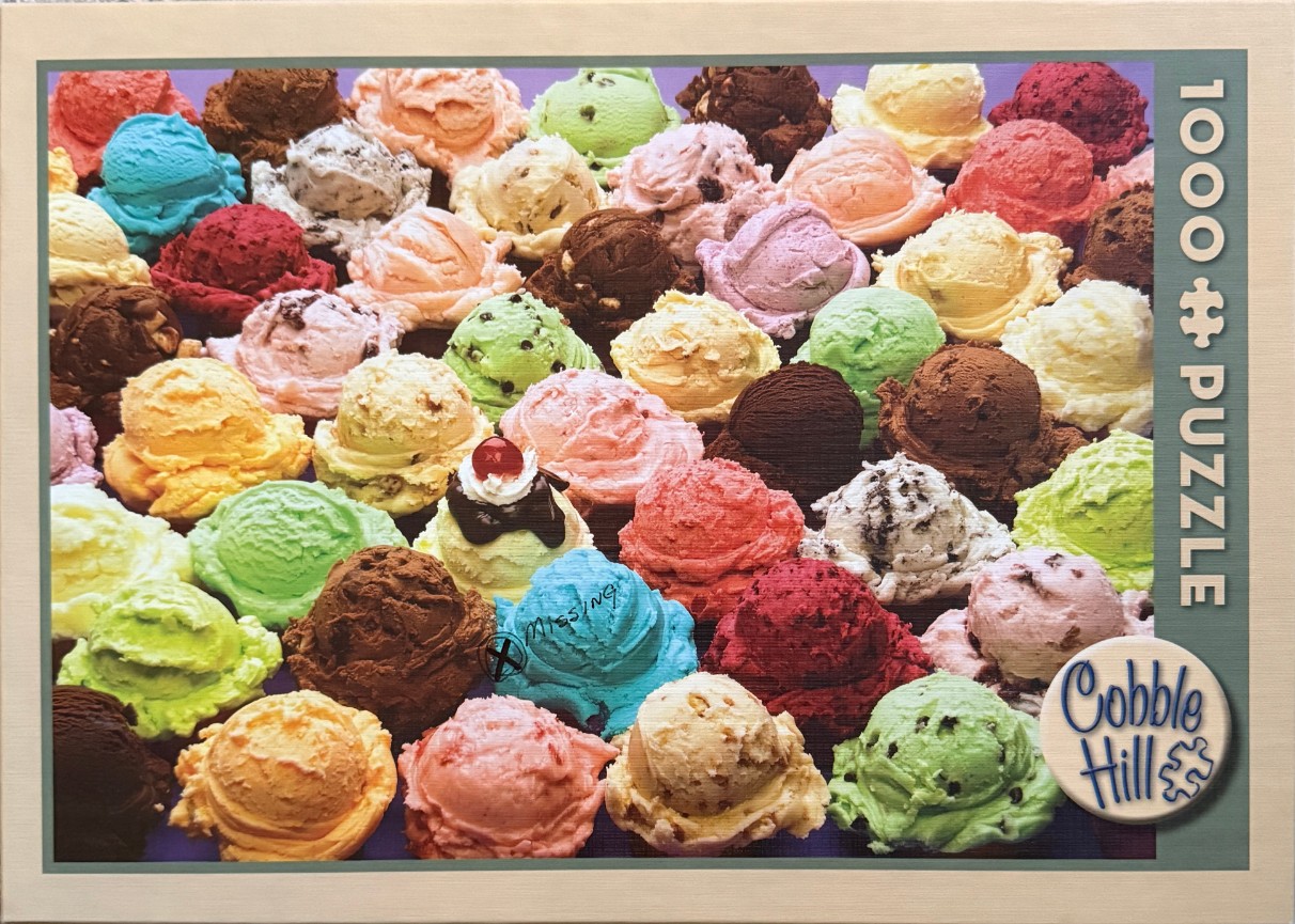 Many scoops of colorful ice cream in various flavors packed tightly together.