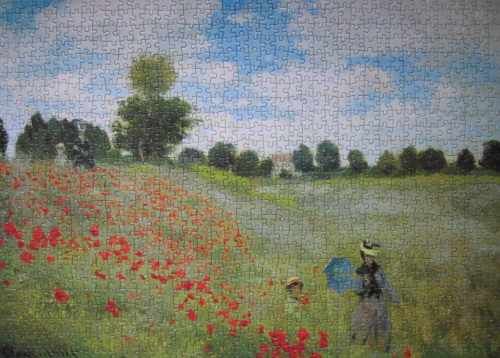 A Claude Monet painting of two figures walking through a field of vibrant red poppies under a bright blue sky.