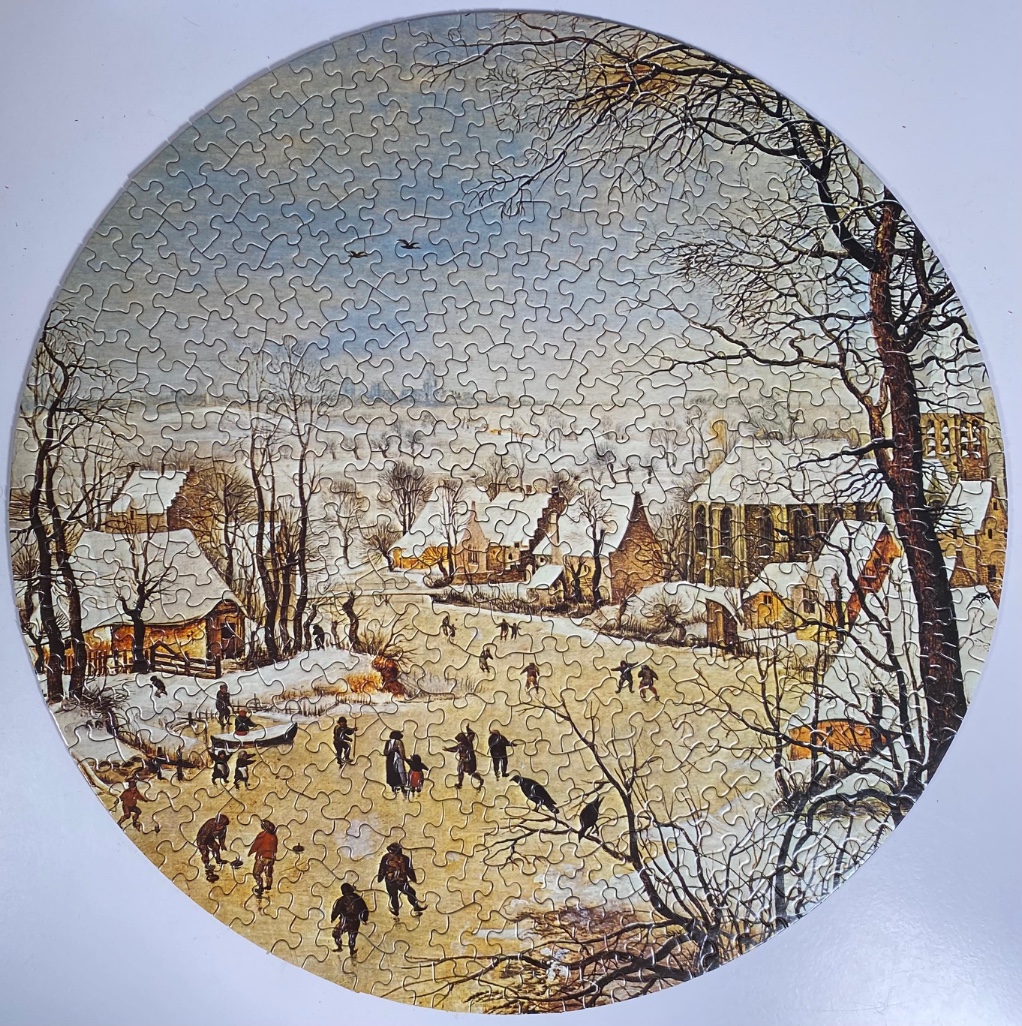 A circular winter landscape painting of a frozen village pond with many people ice skating.