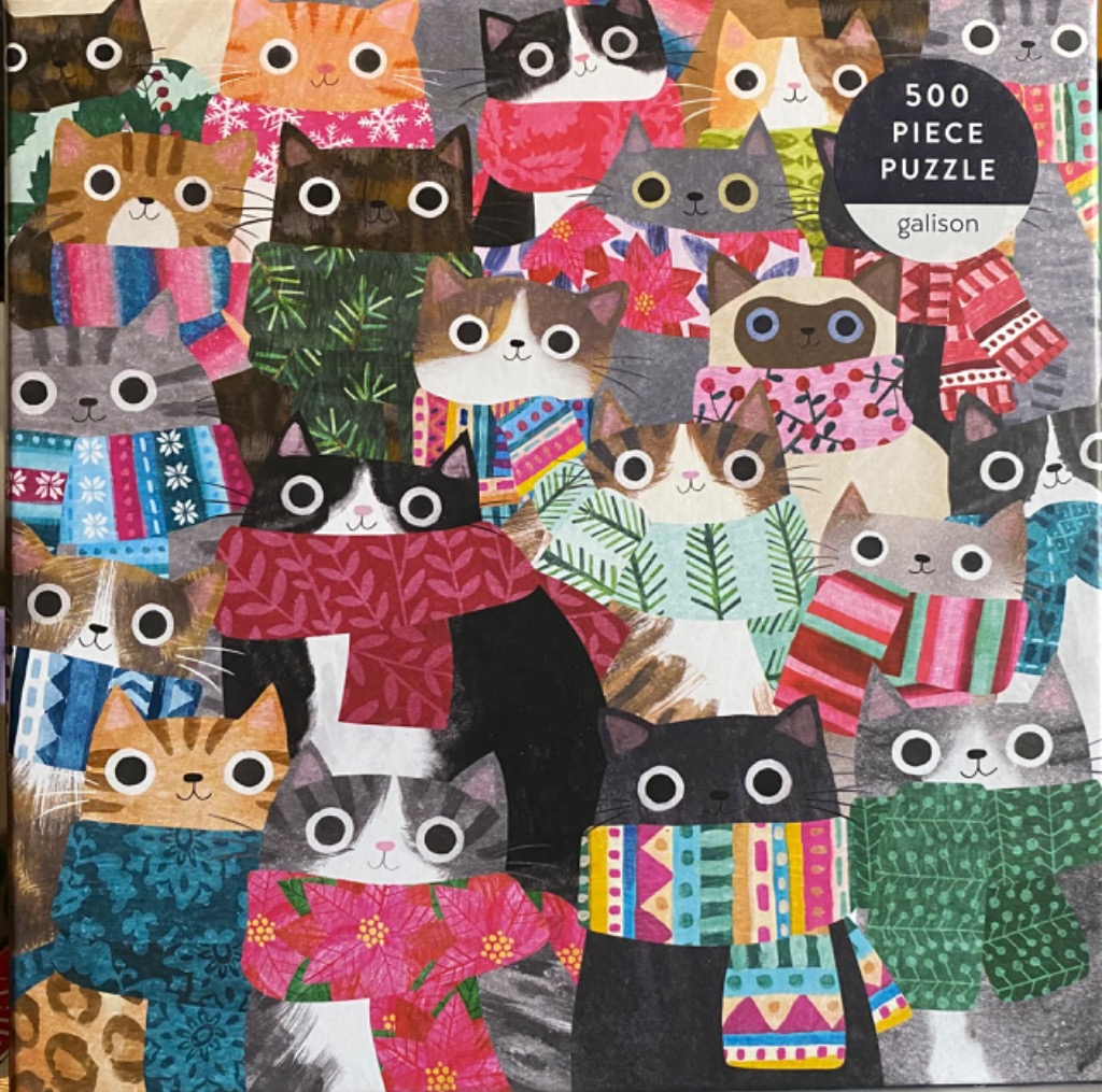 A whimsical illustration of many cartoon cats wearing colorful, patterned winter scarves.