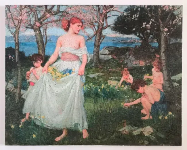 A painting of a red-haired woman and children picking flowers in a spring meadow by the sea.
