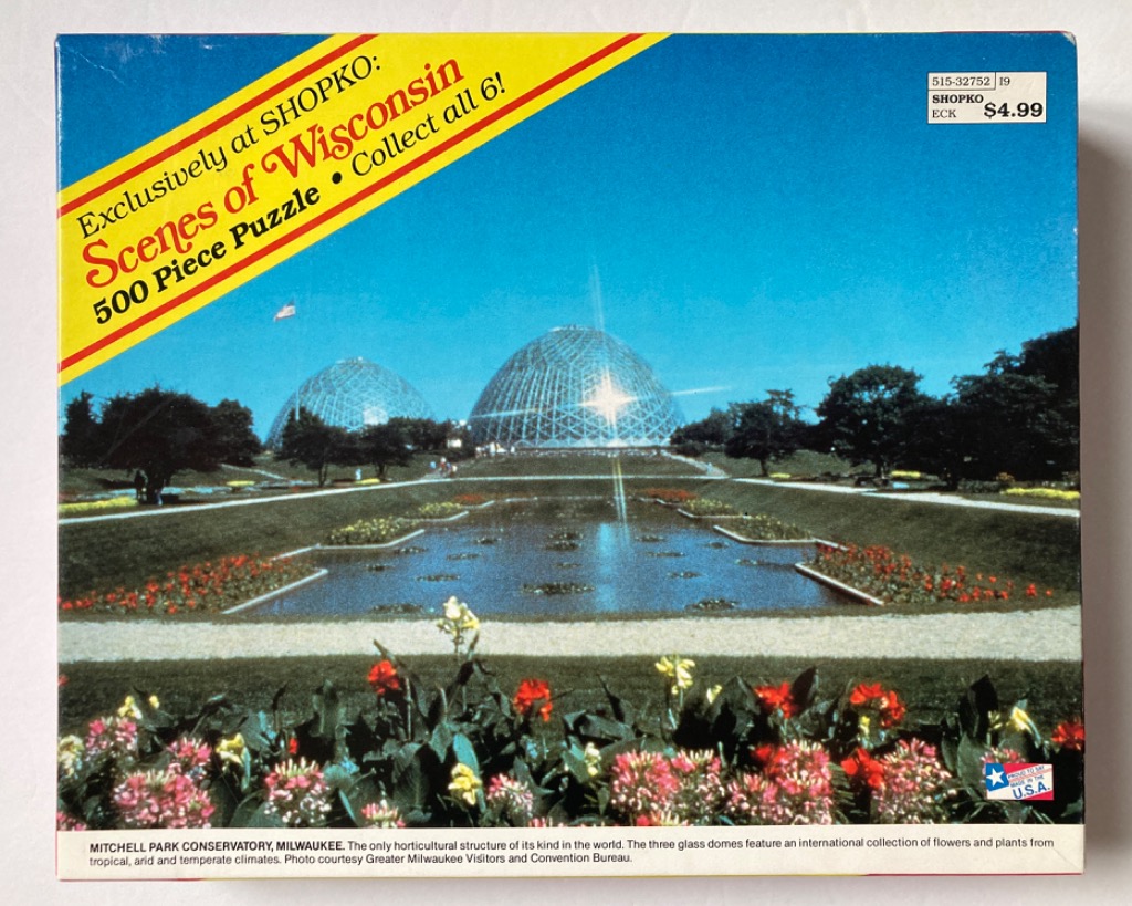 A clear, sunny photograph of the Mitchell Park Conservatory Domes in Milwaukee, Wisconsin.