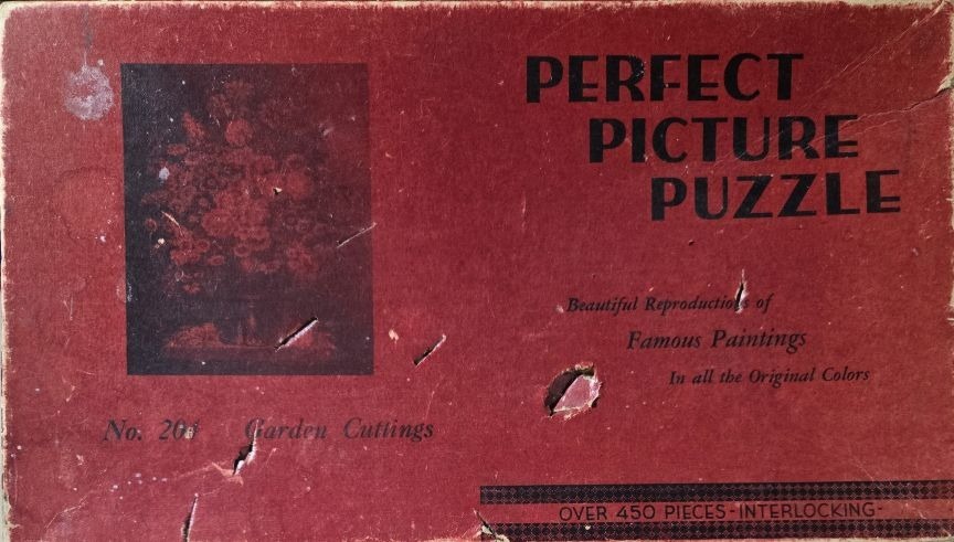 Vintage box artwork showing a dark still life painting of flowers in a vase on a deep red background.