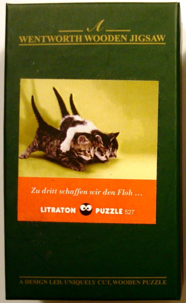 Three tabby kittens playing against a yellow background