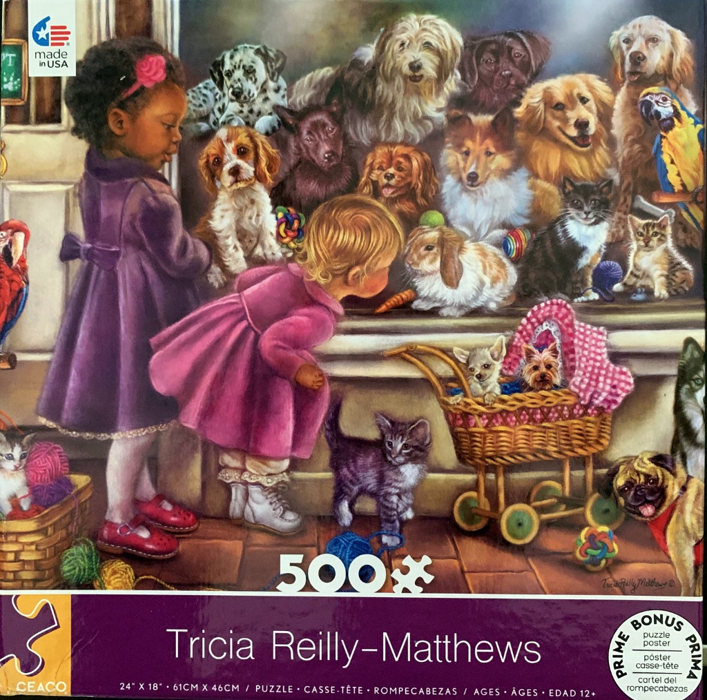 Two young girls looking through a window at a large group of dogs, cats, and a parrot.