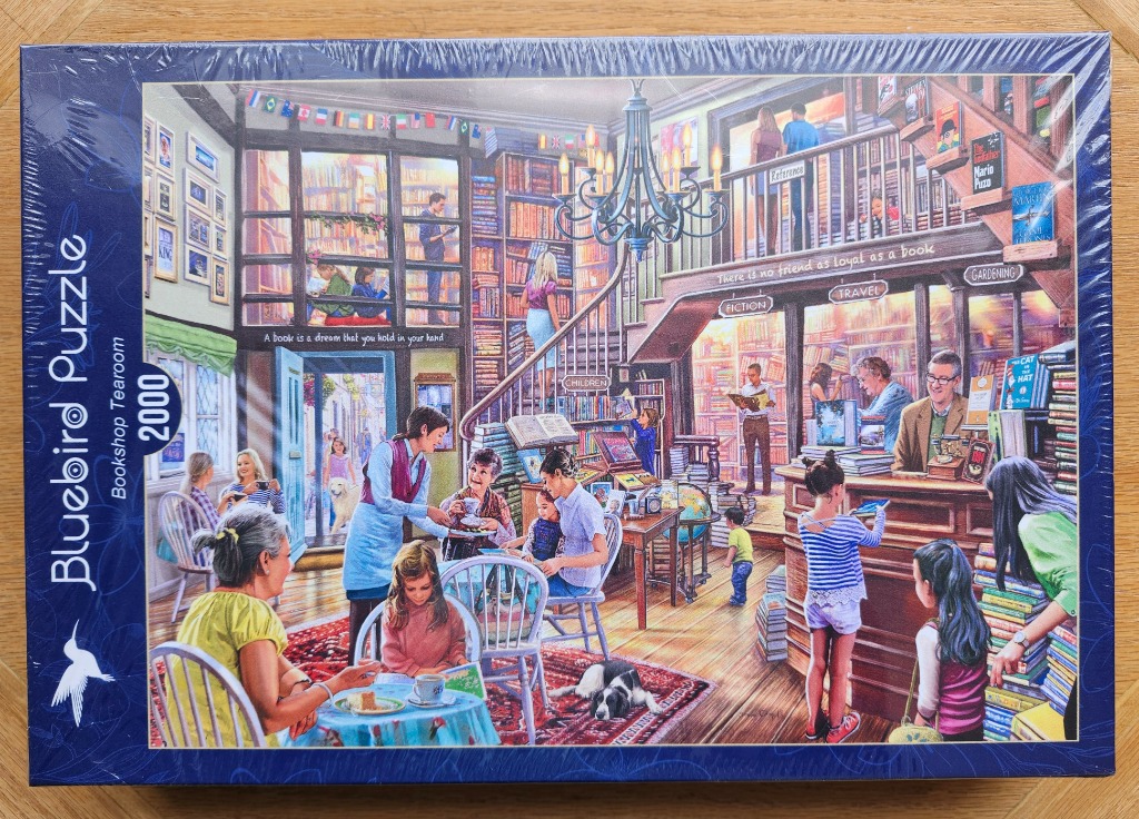 A cozy, multi-level bookshop interior filled with people reading, browsing shelves, and enjoying tea.
