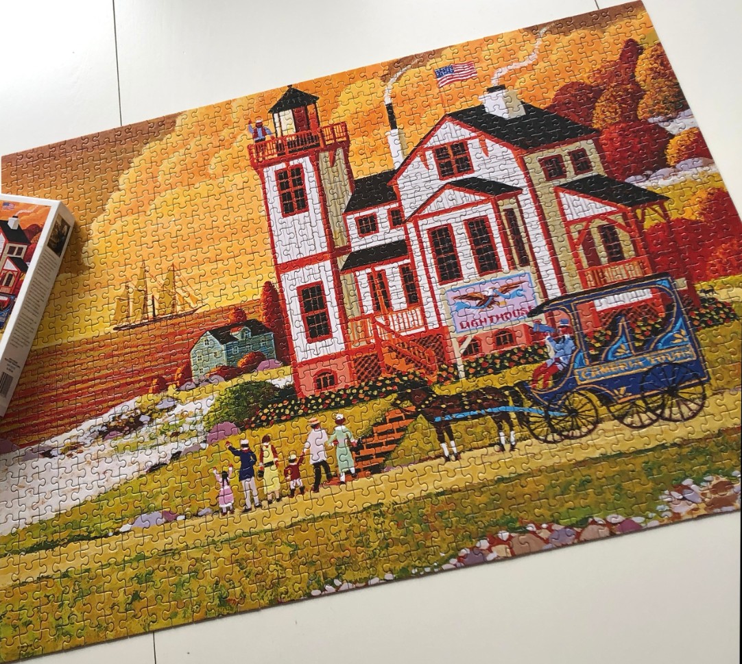 Folk art scene of a lighthouse, horse-drawn carriage, and family on an autumn coast.