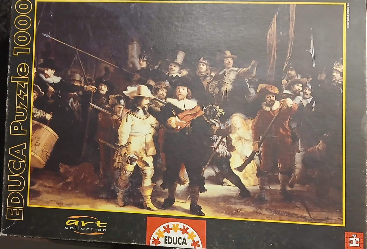 Rembrandt's The Night Watch oil painting showing a group of figures in 17th-century military attire.