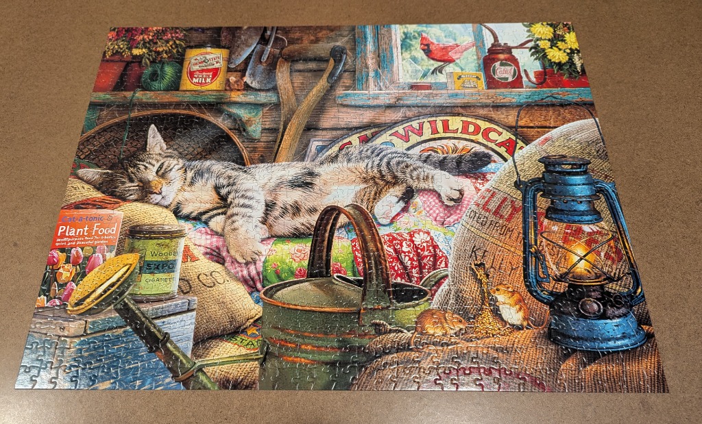 A tabby cat sleeping in a cluttered garden shed with a lit lantern and mice.