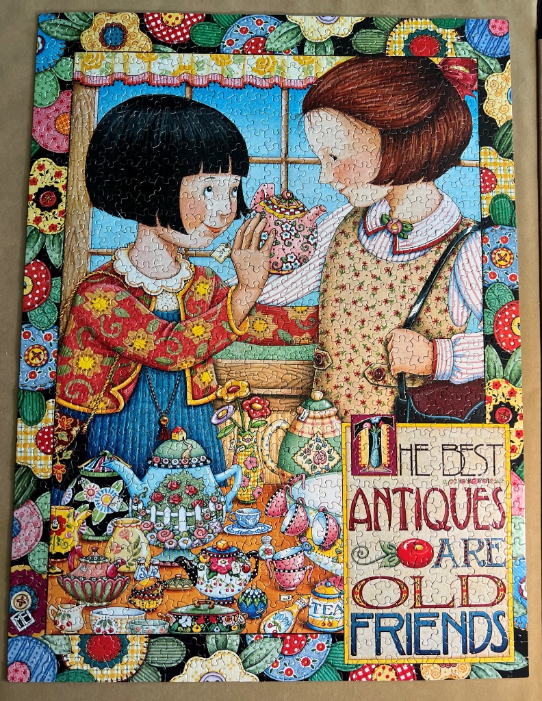 Two children in an antique shop surrounded by floral teapots and the text The Best Antiques Are Old Friends.