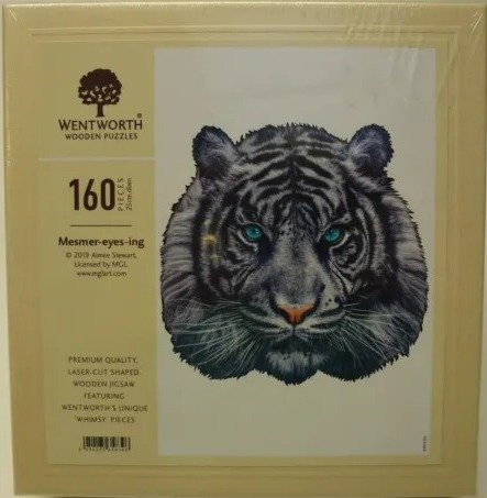 A close-up portrait of a tiger with striking teal-coloured eyes set against a plain white background.