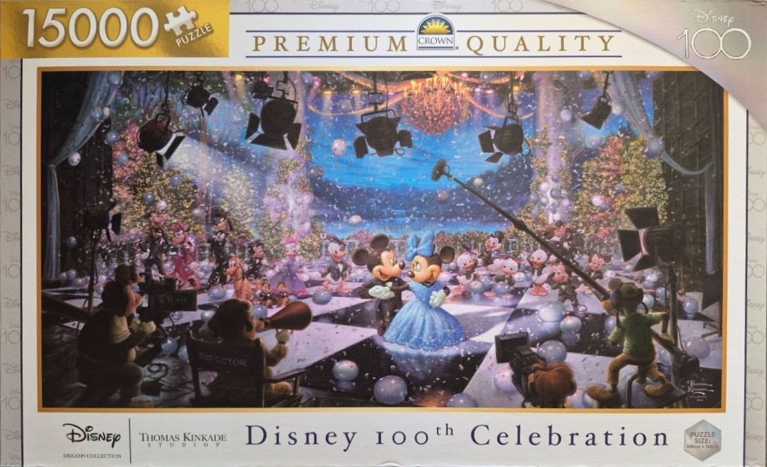 Mickey and Minnie Mouse dancing on a film set surrounded by Disney characters, confetti, and production equipment.