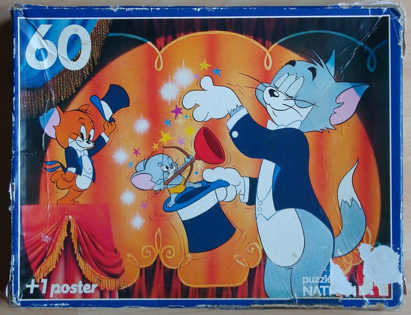 Tom and Jerry performing a magic show on a theatrical stage