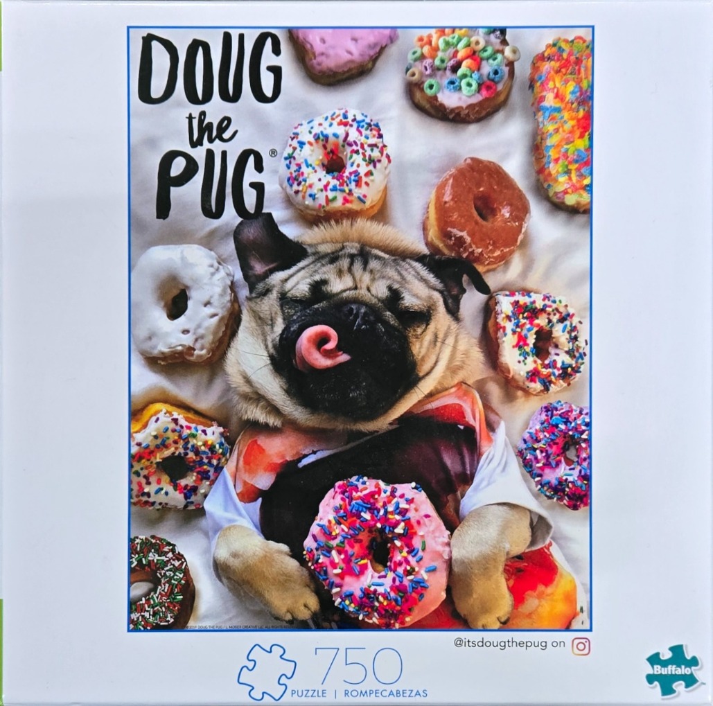A pug dog lying among many colourful, sprinkled donuts on a white sheet.