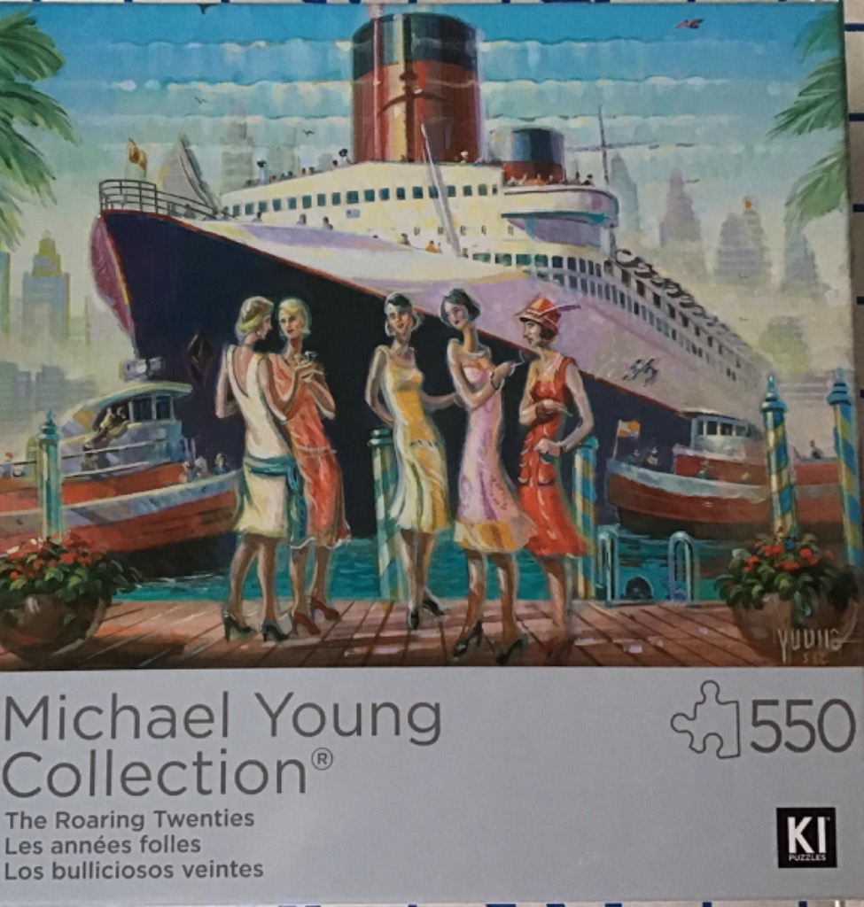 Five women in 1920s flapper attire standing on a pier in front of a large ocean liner.