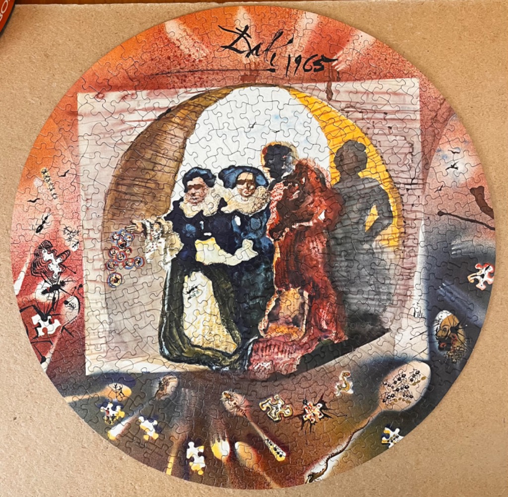 A circular art print of a surrealist painting featuring figures in elaborate clothing and insects.
