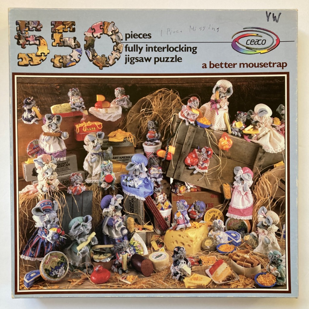 A collection of whimsical, cloth-crafted mice figurines arranged amidst wooden crates and scattered cheese.