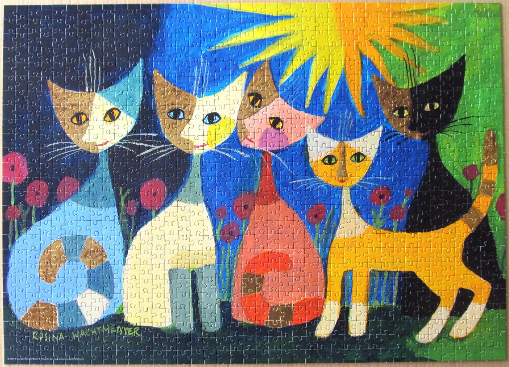 A whimsical illustration of five colorful, stylized cats standing in a garden with a bright sun overhead.