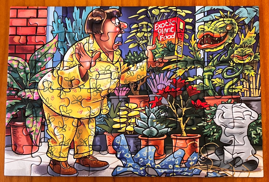 Cartoon of a person in a yellow floral robe offering plant food to a monstrous plant.