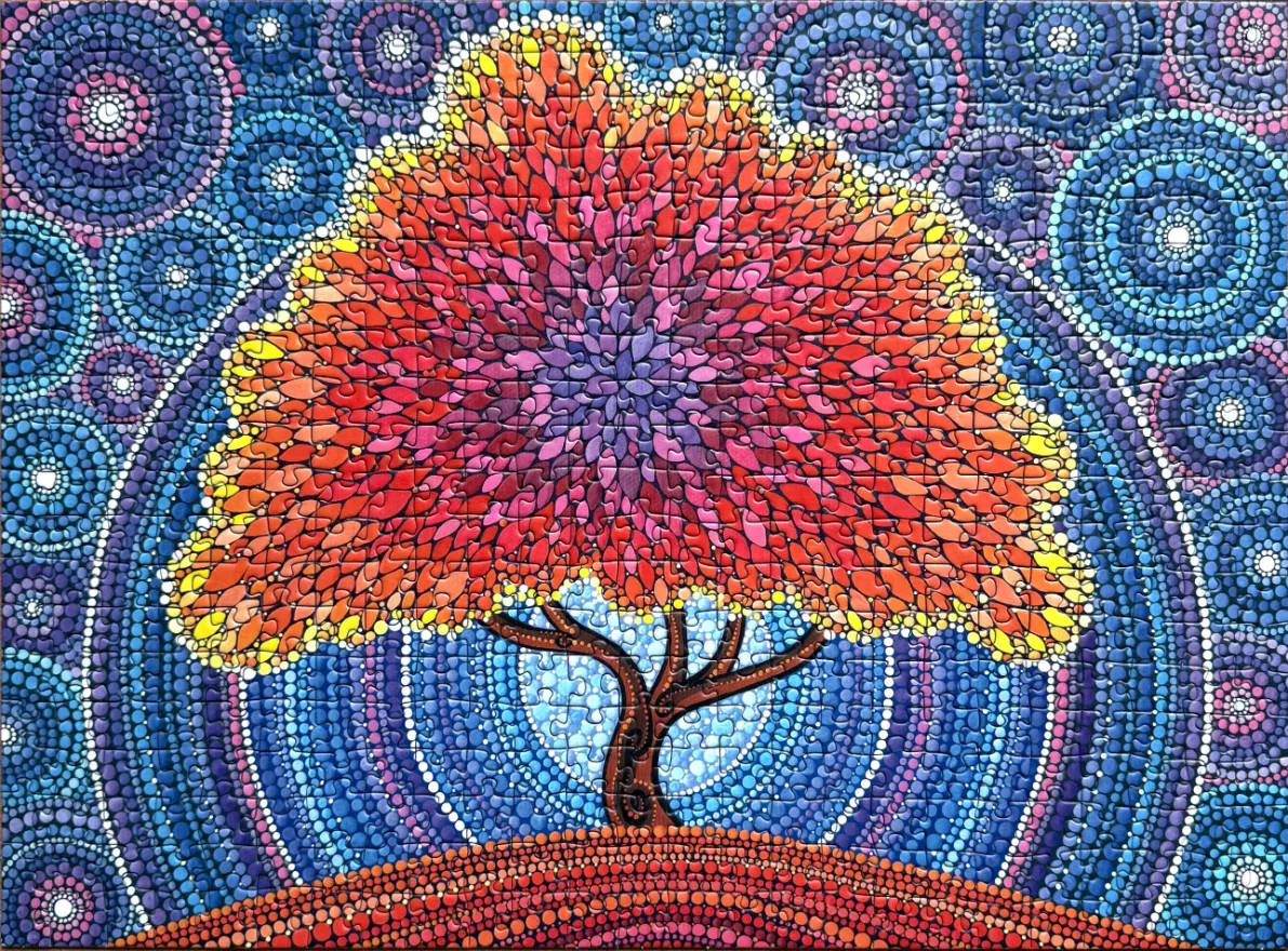 Stylized tree with a dense canopy of red and orange petal-like shapes against a background of blue circular patterns.