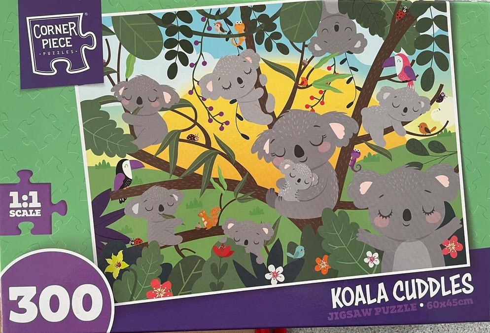 Cartoon illustration of several gray koalas cuddling and climbing in a tree with a bright yellow sun in the background.