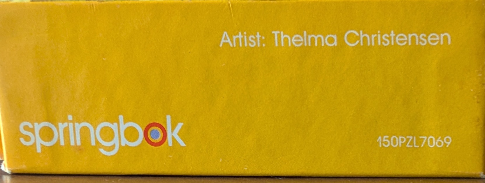 Yellow box with "Artist: Thelma Christensen" and "springbok" logo.