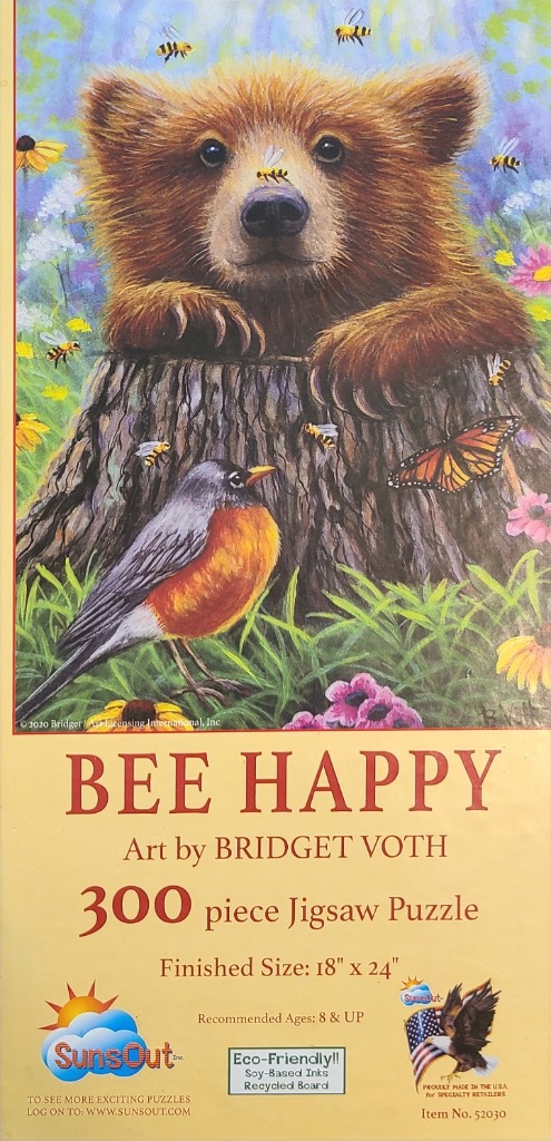 A cute brown bear cub peeking over a tree stump surrounded by bees, flowers, and an American robin.