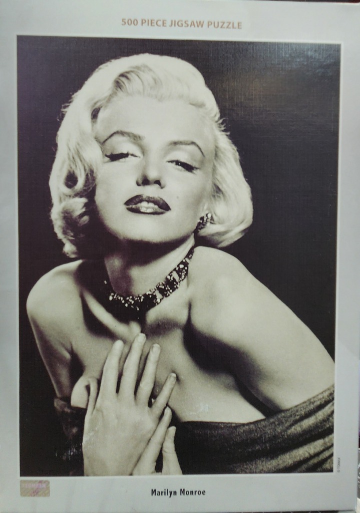 Classic black and white portrait of Marilyn Monroe wearing a dark choker necklace