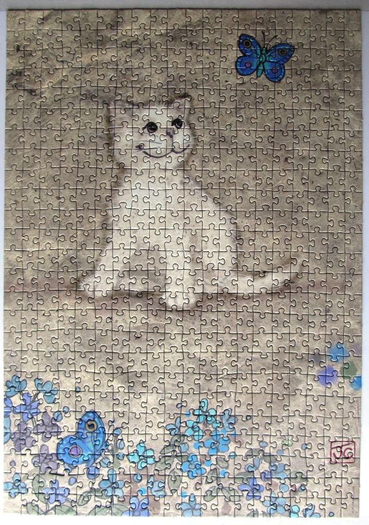 A whimsical illustration of a white cat sitting in a field of blue flowers with two butterflies.