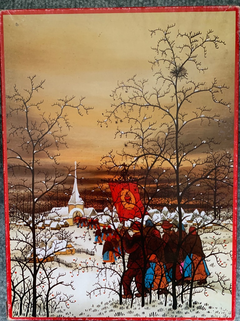 A religious procession in a snowy village scene with bare trees, a red banner, and a church in the background.