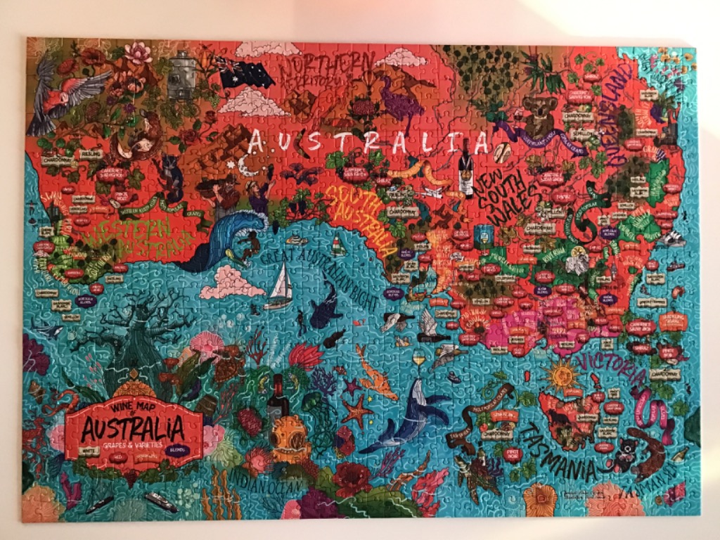 An illustrated map of Australia showcasing wine regions, local wildlife, and coastal landscapes.