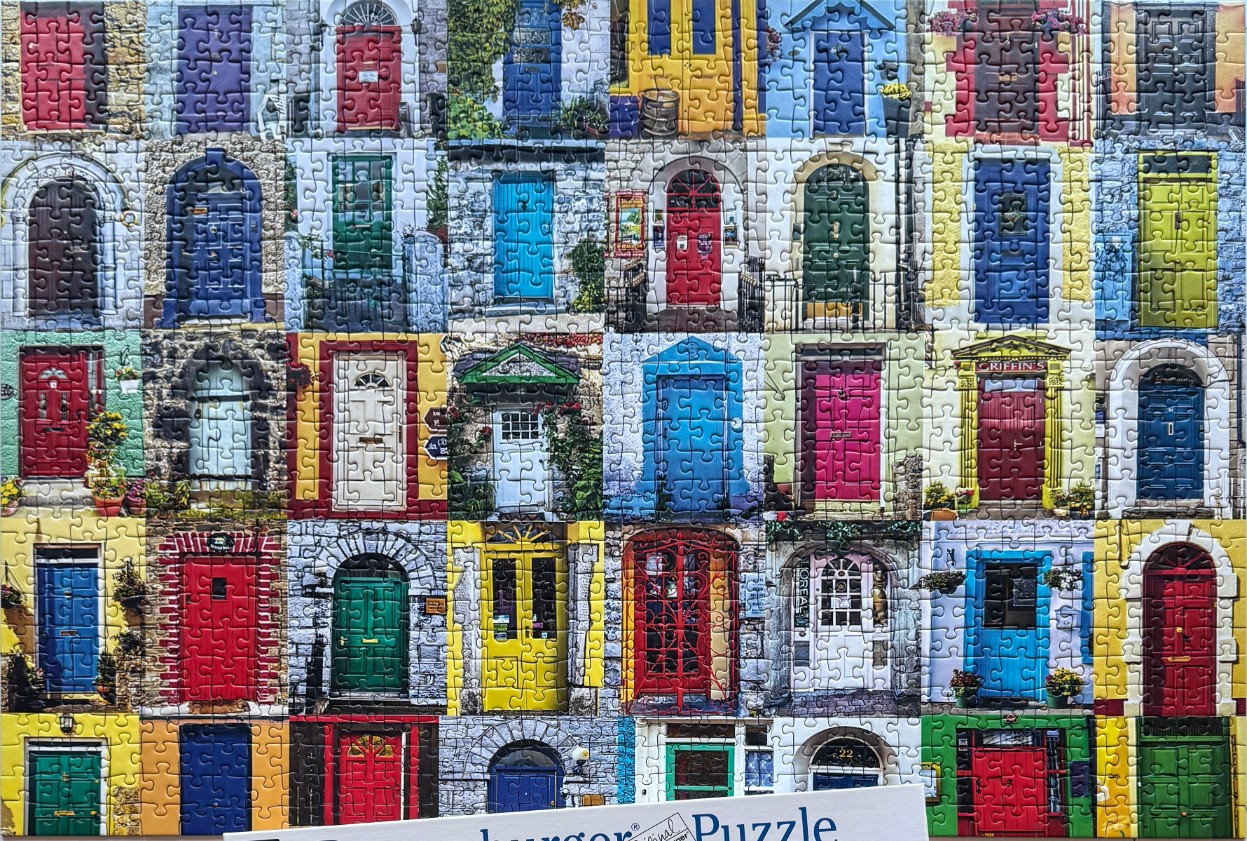 A collage of many colorful front doors from various buildings.