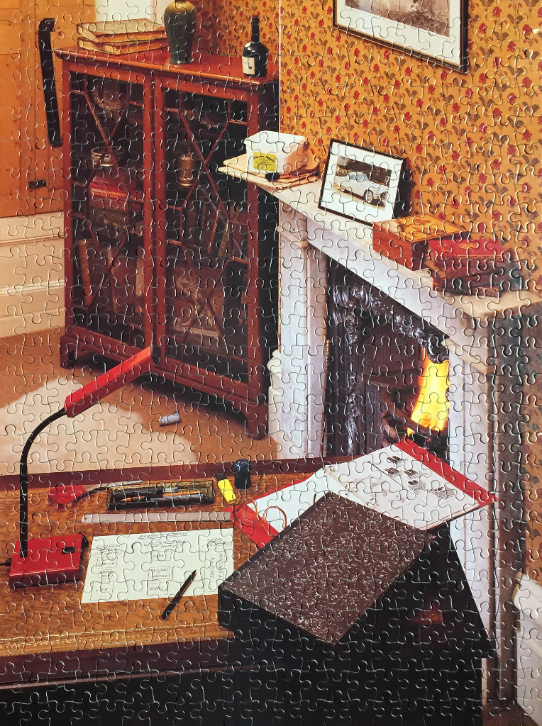 Cozy room with fireplace, desk, and bookshelf. Warm colors, detailed interior scene.
