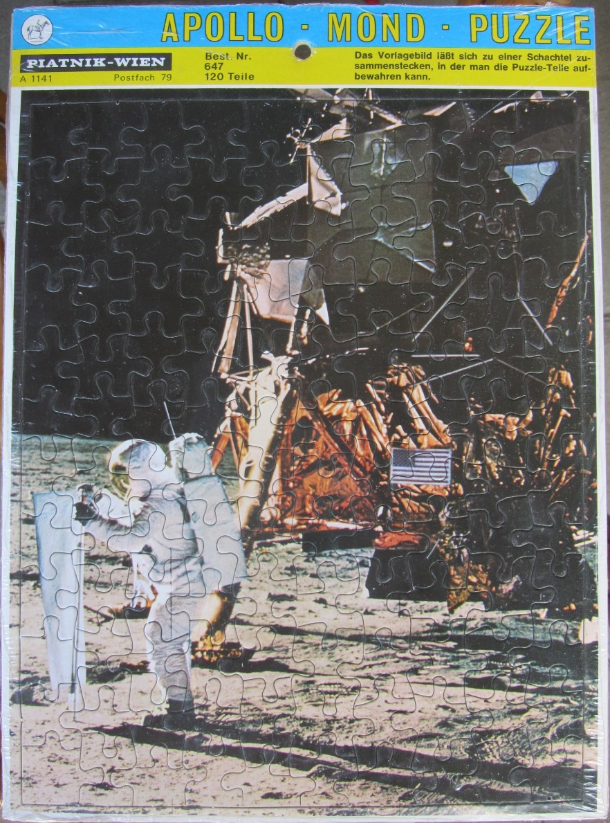An astronaut stands on the lunar surface in front of the Apollo Lunar Module.