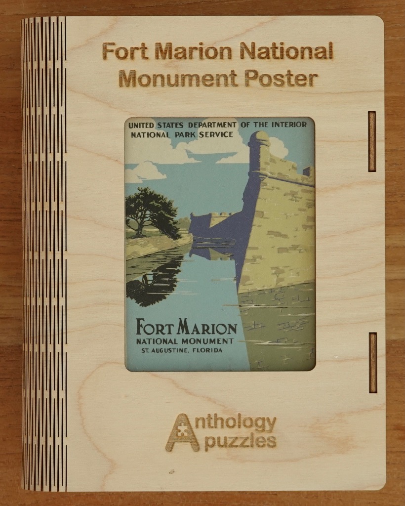 Vintage National Park Service poster of Fort Marion, featuring stone walls reflected in a moat under a blue sky.