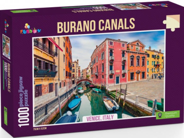 A scenic view of a canal in Burano, Italy, featuring colorful houses and moored boats.