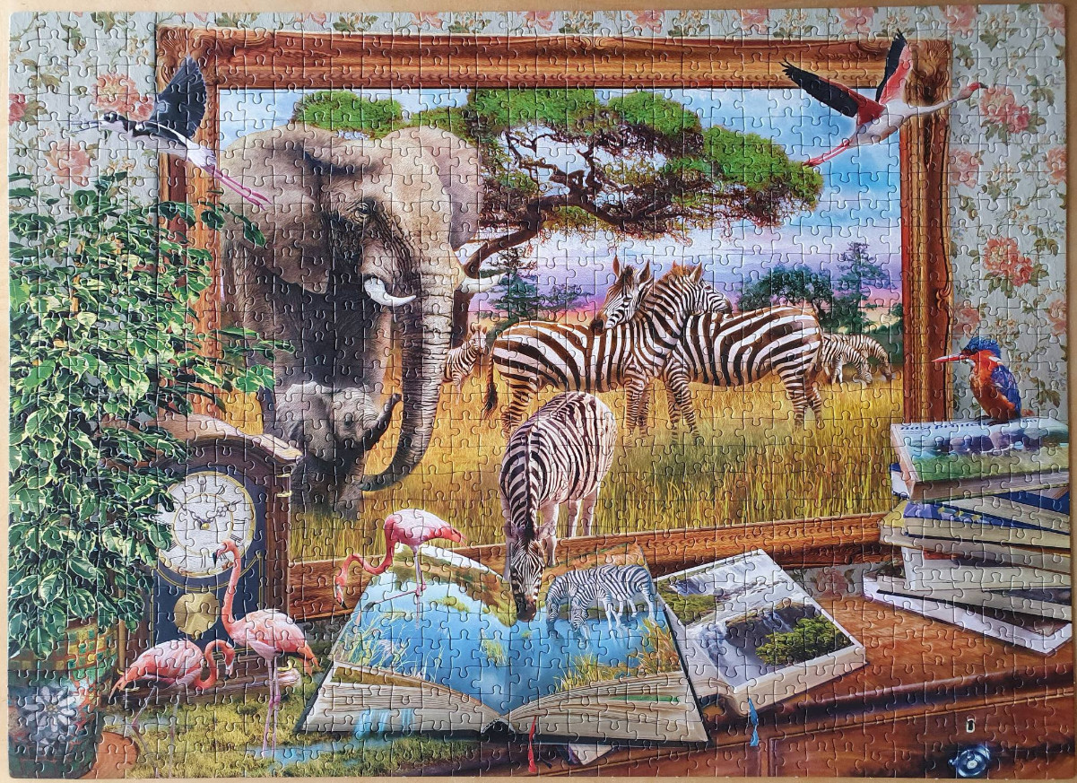 A whimsical illustration of African wildlife framed as a painting with an open book and flamingos in the foreground.
