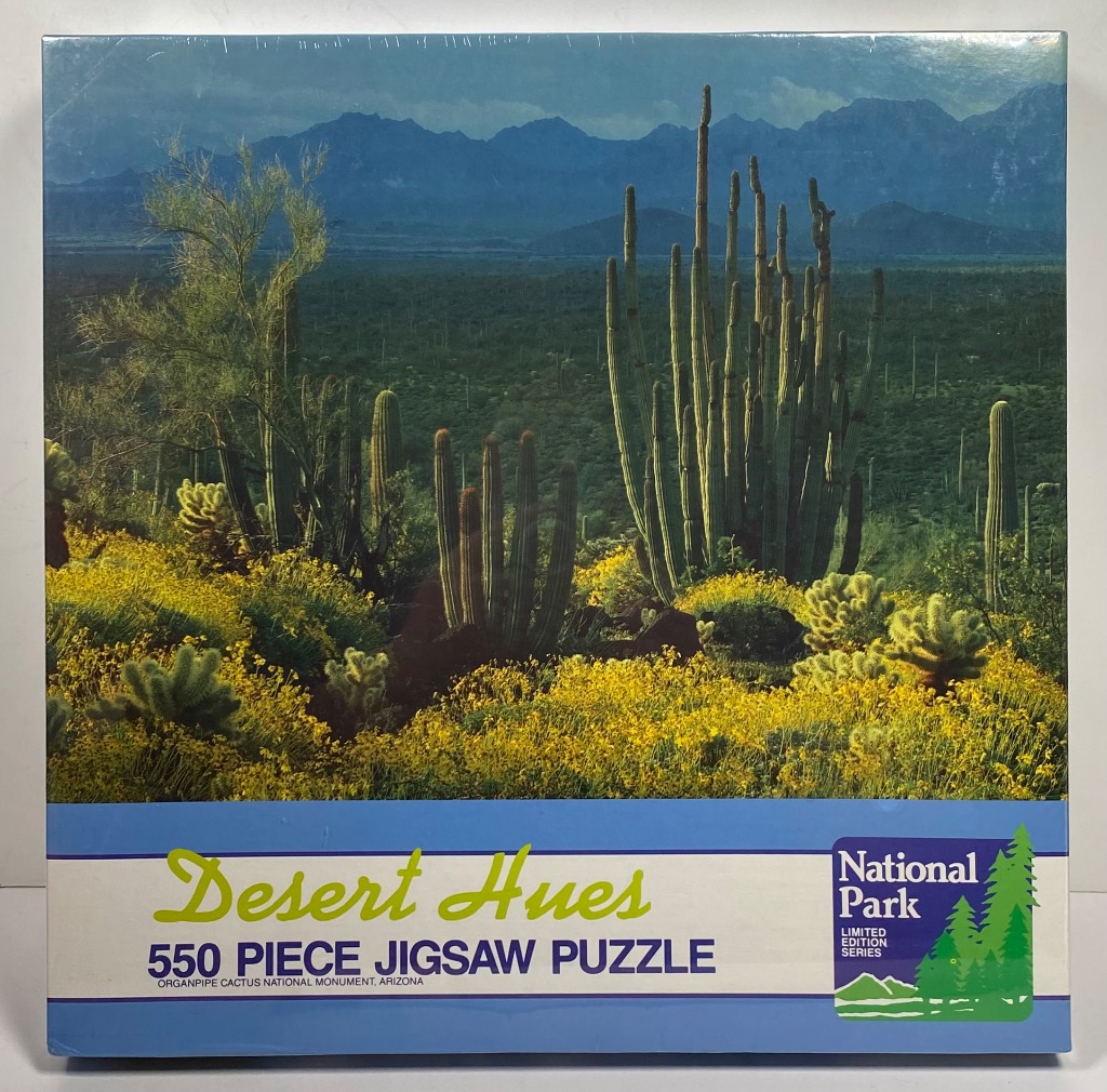 Organ Pipe Cactus National Monument in Arizona with blooming yellow desert wildflowers and mountains in the background.