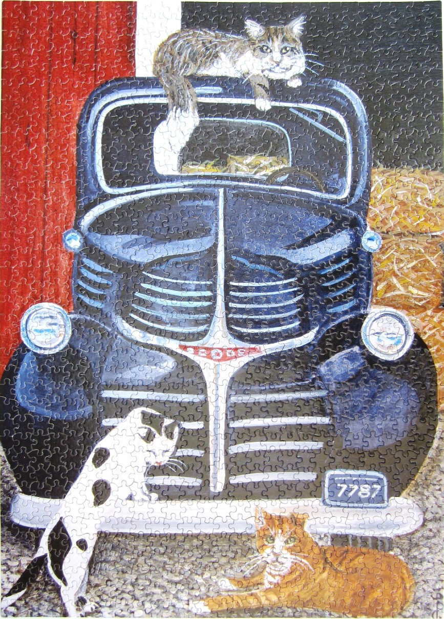 An illustration of three cats around a vintage dark blue truck parked in front of a red barn and hay bales.
