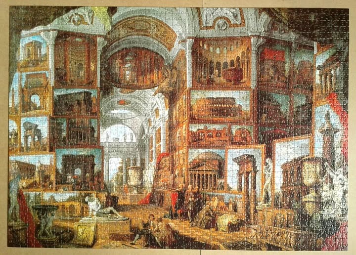 A painting of a classical gallery filled with paintings of Ancient Roman ruins and monuments.