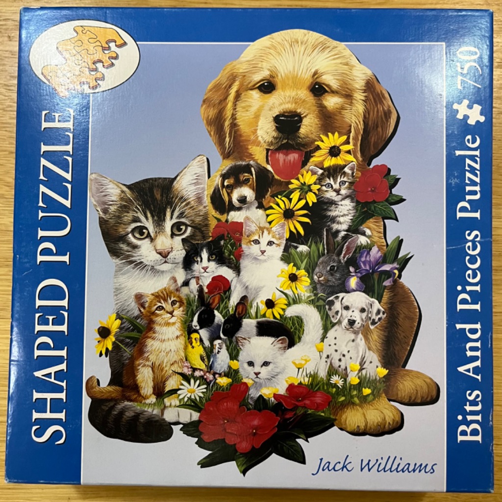 A collection of various puppies, kittens, and small animals nestled among colorful flowers.