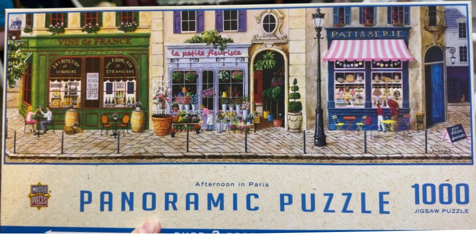 An illustration of a charming Parisian street with a wine shop, a flower shop, and a bakery.